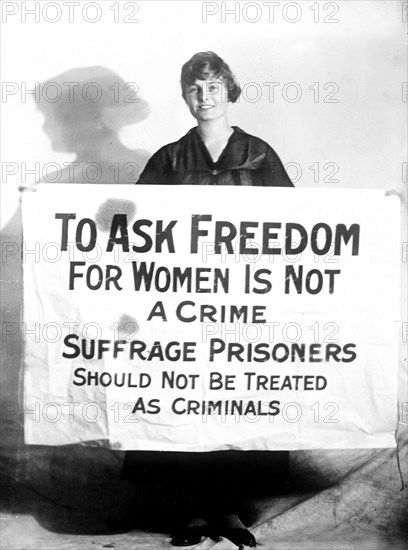 Woman Suffrage Movement - Woman suffragette Lucy Branham holding poster circa 1919.