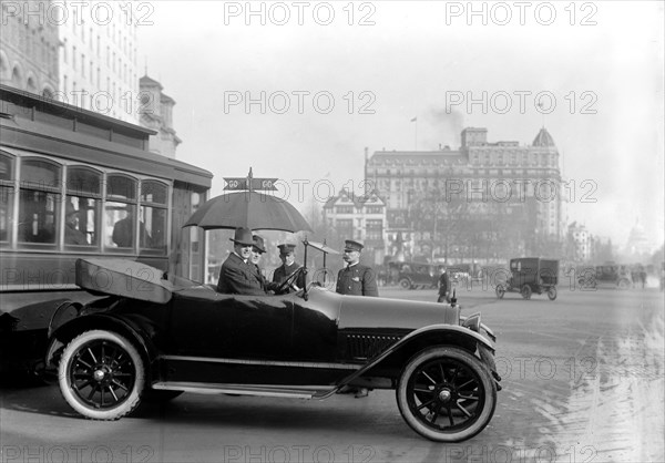 Washington D.C. History - Car on Washington Street obeying stop and go traffic sign circa 1913.