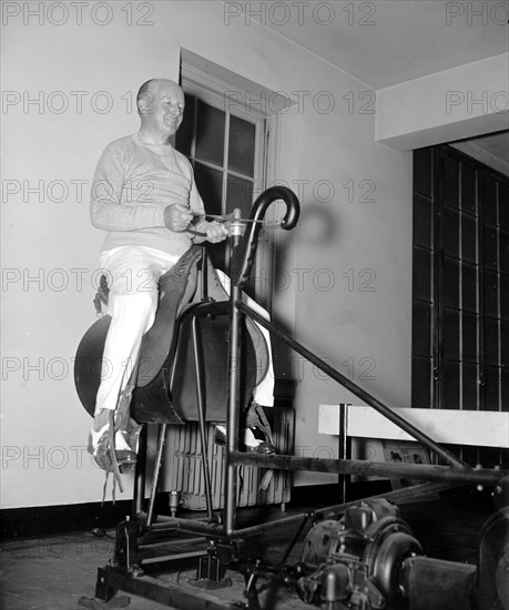 Historical Exercise - Rep. Charles Clason, Mass. On the electric horse at the House gym circa 1937 .