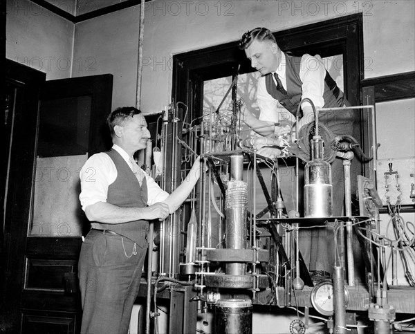 Government scientists conducting tests on electrical current circa 1938.