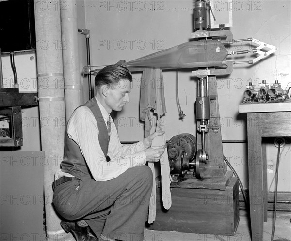 Government waste - Government employee testing panty hose circa 1938.