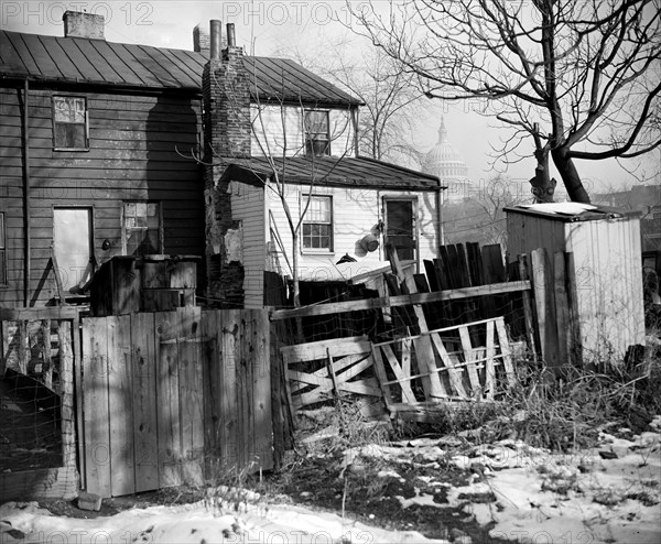 Slums in Washington D.C. which are in view of the Capitol will be replaced with public housing ca.1938 .