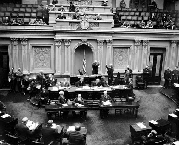 Scene in the United States Senate chamber as Vice President Garner administers the oath to Senator Elmer Thomas, re-elected from Oklahoma in last November's election circa 1/4/1939.
