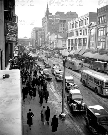Cars, buses and pedestrians in Washington D.C. street scene circa January 1939 (P Street) .