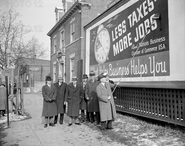 Chamber of Commerce billboard touting less taxes and more jobs circa 1939.