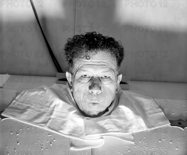 Louisiana Senator Senator Ellender relaxing with a steam bath circa 1938 .