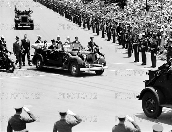 King and Queen of England (Great Britain) in an automobile visiting Washington D.C. circa 1938 or 1939 .