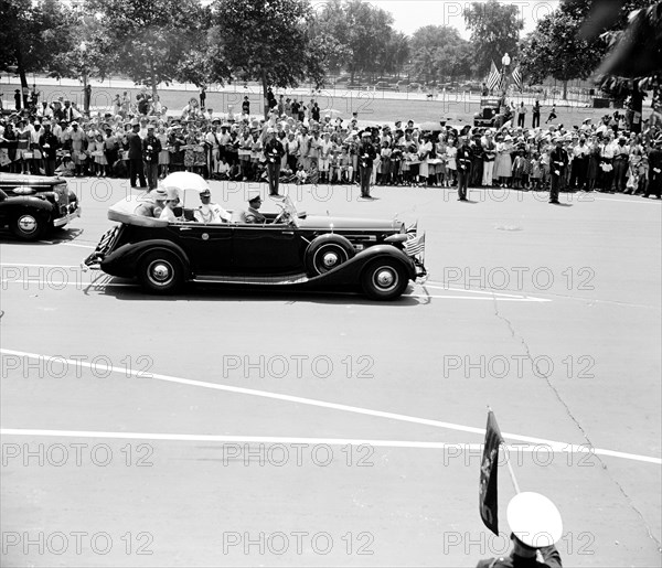 King and Queen of England (Great Britain) in an automobile visiting Washington D.C. circa 1938 or 1939 .