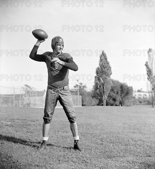 Slinging Sammy' Baugh, new addition to the Washington Redskins, poses for reporters circa September 1937.
