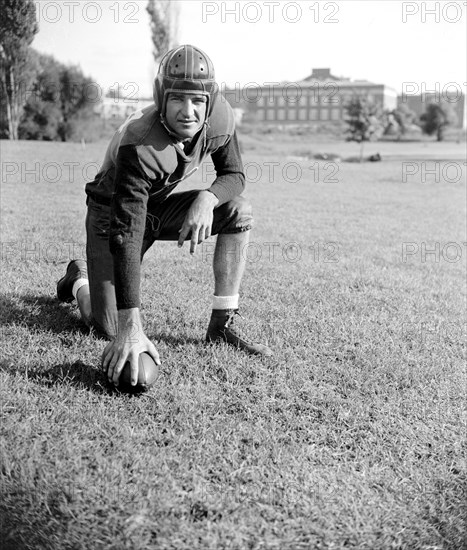 Slinging Sammy' Baugh, new addition to the Washington Redskins, poses for reporters circa September 1937.