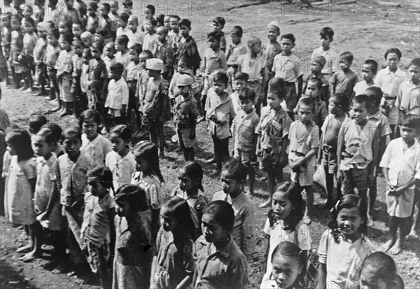 Ambarawa: The Dutch Indian school was festively opened on 20 September. The children listen to the teacher circa September 20, 1947 / Location Indonesia, Dutch East Indies.