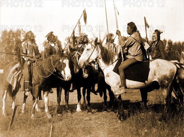 Edward S. Curtis Native American Indians - Six Crow Indians in full regalia, on horseback, Montana circa 1908.