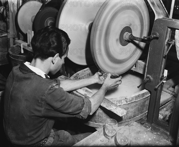 Workers in glass industry (grinding glass) / Date November 18, 1947.