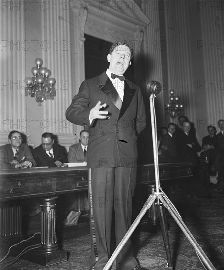 Senator Huey P. Long speaking in early 1935 .