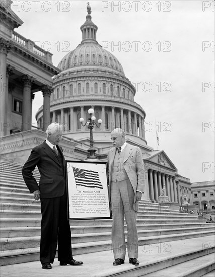Men holding sign 'The American's Creed' in front of U.S. Capitol, Washington, D.C. circa 1936.