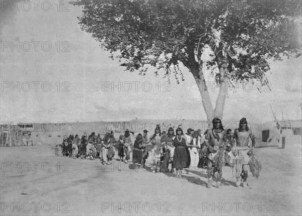 Edward S. Curtis Native American Indians - Tewa Indians dancing in line formation circa 1905.