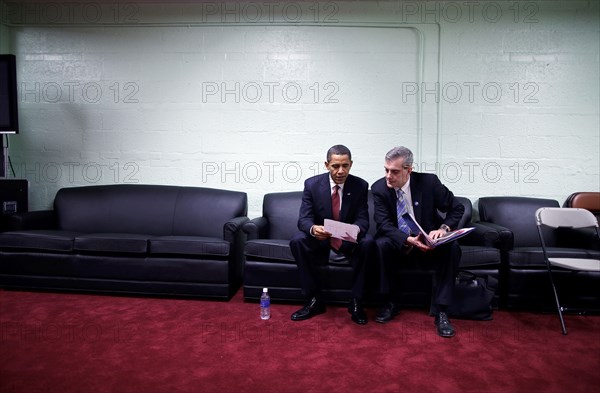 Following a policy speech on Iraq at Camp Lejeune, North Carolina, President Barack Obama is briefed by Denis McDonough, Deputy National Security Advisor,  before a TV interview 2/27/09. .