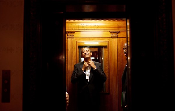 Early in the morning on Jan. 21st, President Barack Obama rides the elevator to the Private Residence of the White House after attending 10 inaugural balls and a long day including being sworn in as President at noon on Tuesday, Jan. 20, 2009.  .