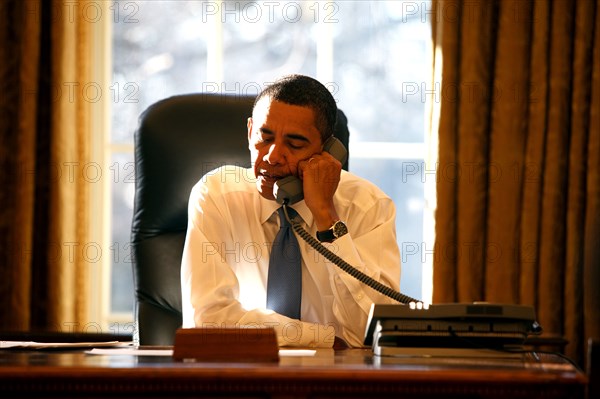 President Barack Obama speaks with a  foreign leader in the Oval Office on his first day in office 1/21/09.  .