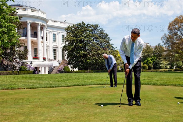 President Barack Obama and Vice President  Joe Biden practice their putting on the White House putting green April 24, 2009. .