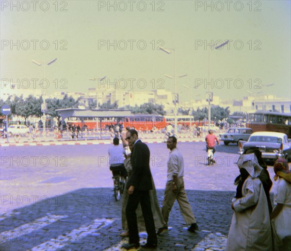 Pedestrians crossing a street in a Casablanca neighborhood circa 1969.