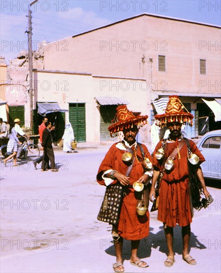 Watermen posing for a photograph in Marrakesh Morocco circa 1969.
