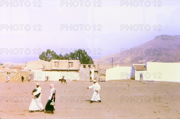 Men walking in a village in Morocco circa 1969.