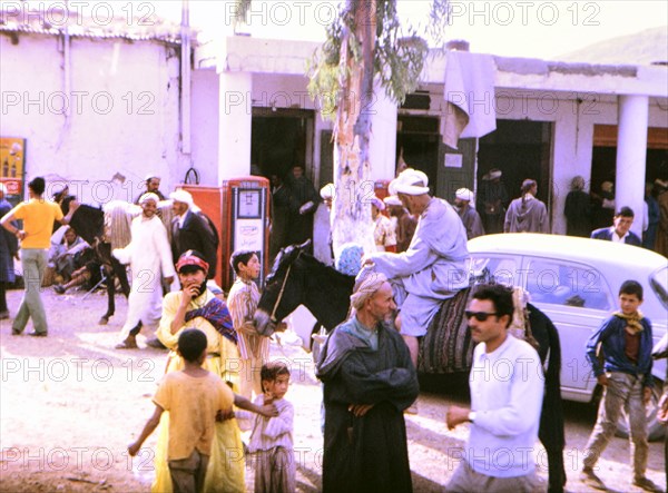 People outside a petrol station in an unidentified city in Morocco circa 1969.