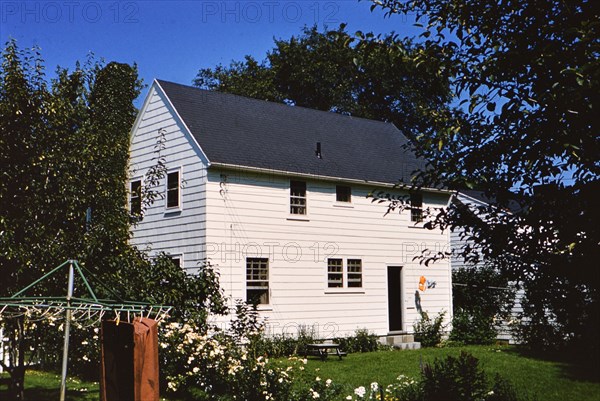 White home in small town with big yard in the 1950s (ca. 1958).