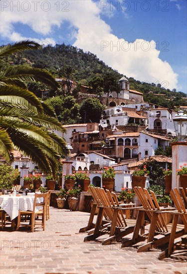 Homes on the side of a hill in a village in Mexico in the early 1950s .