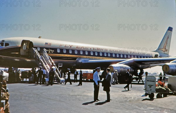 1962 Historical Photo -  Passengers on tarmac at Eastern Airlines Golden Falcon Jet in early 1960s somehwere in Latin America.