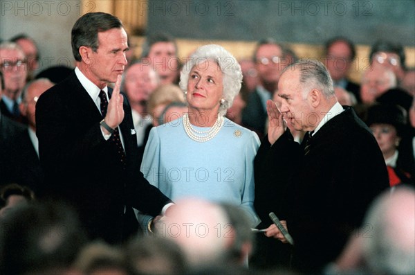 1/21/1985 - Associate Justice of the U.S. Supreme Court Potter Stewart administers Vice President George Bush's second oath of office in the Capital rotunda as Mrs. Bush looks on