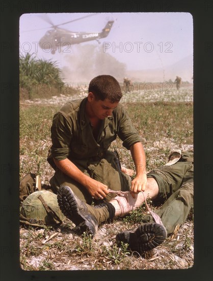 Medic Bandages Wounded Marine