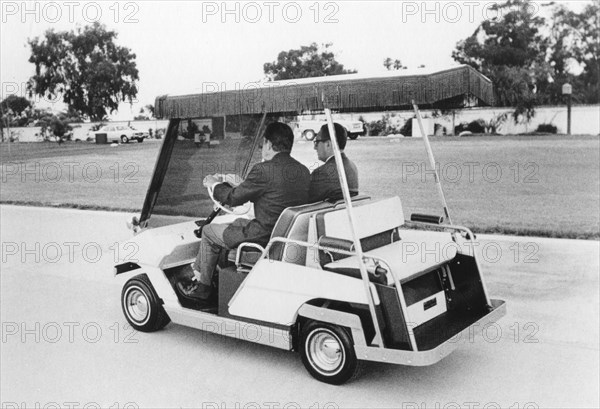 Nixon and Kissinger Ride in Golf Cart