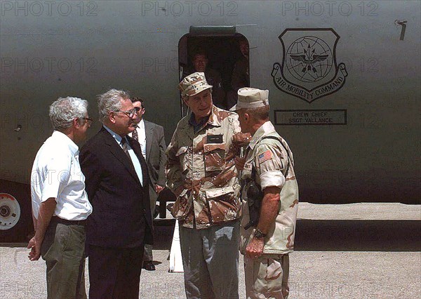 1992 - President George Bush is escorted from a US Air Force C-141 Starlifter by Gen. Robert B. Johnston