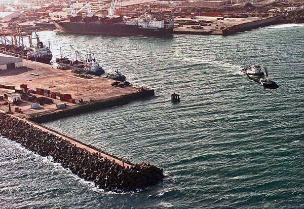 1992 - Aerial view of the Port of Mogadishu.  Three cargo ships