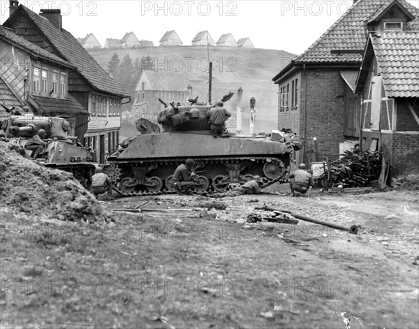 Scattered shots by German snipers disturb the stillness of the town