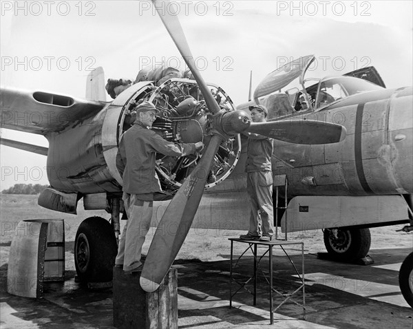 Airman works on a B-26 aircraft