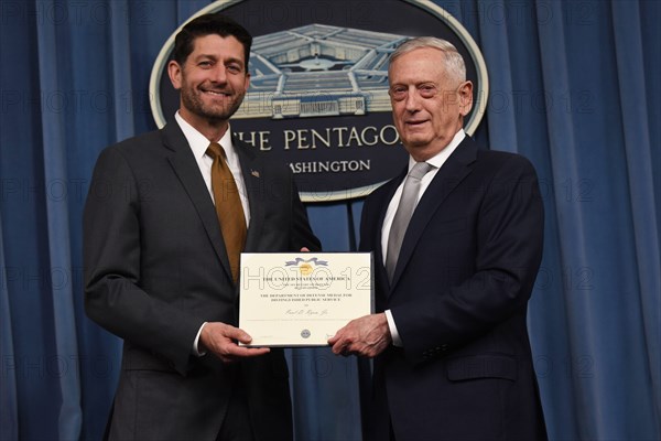 U.S. Secretary of Defense James N. Mattis honors the speaker of the U.S. House of Representatives