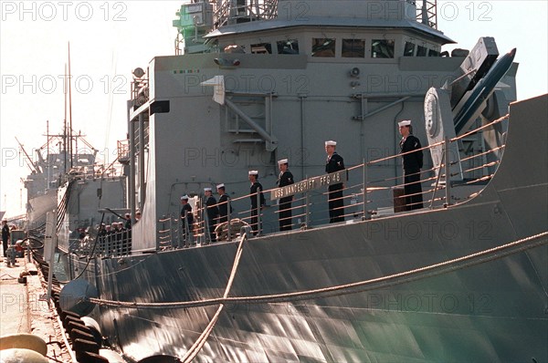 Navy sailors man the rail