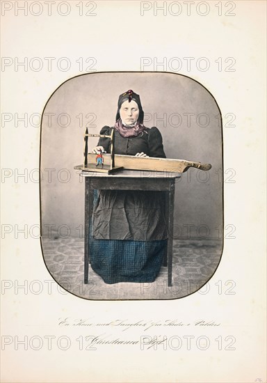 A woman sitting by the table With a langleik in front of her