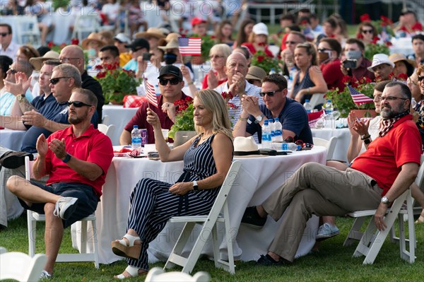 Invited guests are seen on the South Lawn of the White House