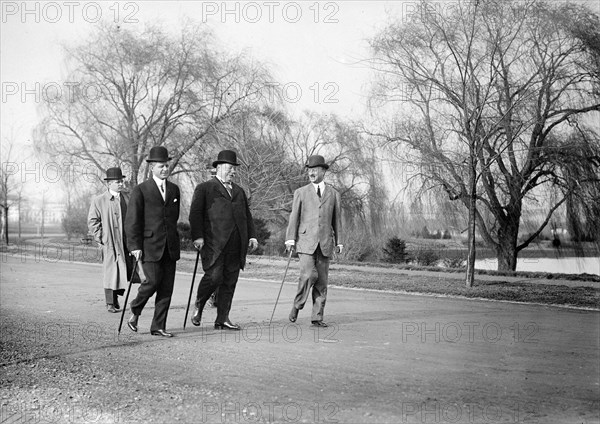 President William Howard Taft walking with Archibald Butt and Charles Dewey Hilles