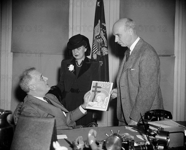 President Franklin Roosevelt buys his annual supply of Christmas Seals from Rockwell Kent