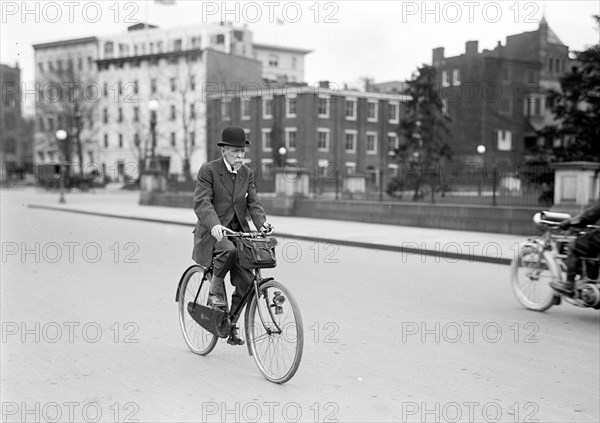 Old man riding his bicycle to work