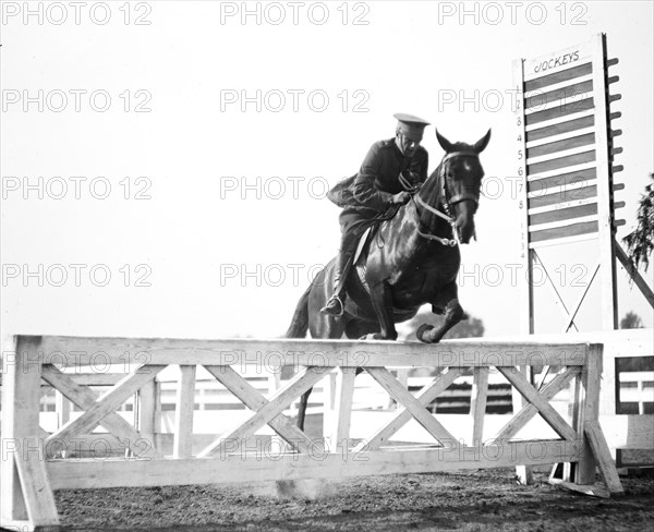 Horse jumping at equestrian event