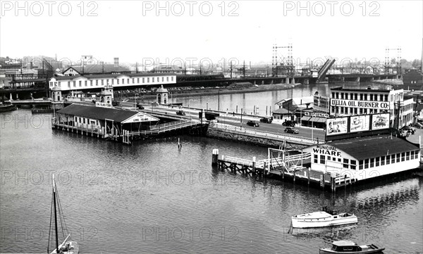 This photograph depicts a low aerial view of the wharves