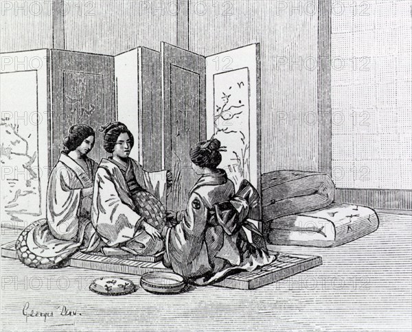 Two Japanese women attend to a woman in labor.