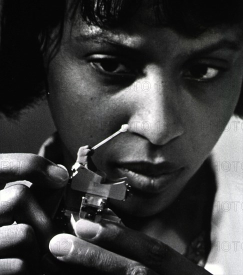 African American Woman working in a research laboratory.