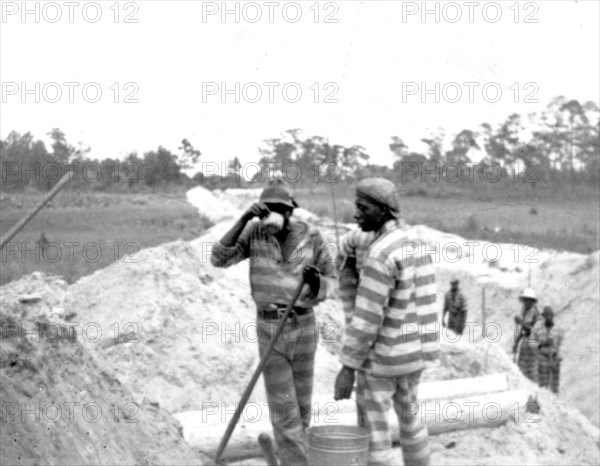 African American convicts working at an outdoor location